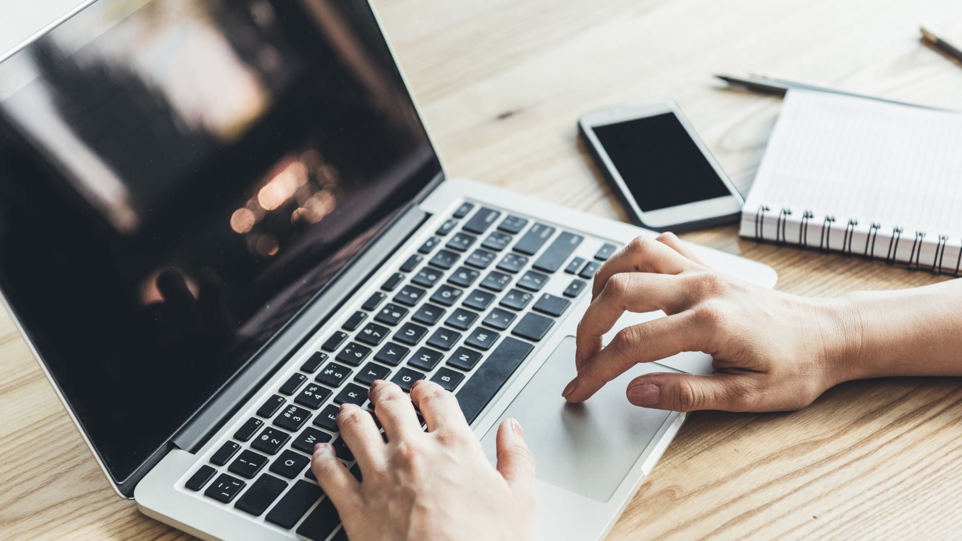 Person working on laptop for PowerUp Video Course
